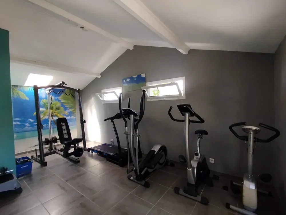 Indoor fitness room equipped with exercise bikes, elliptical bike and treadmill